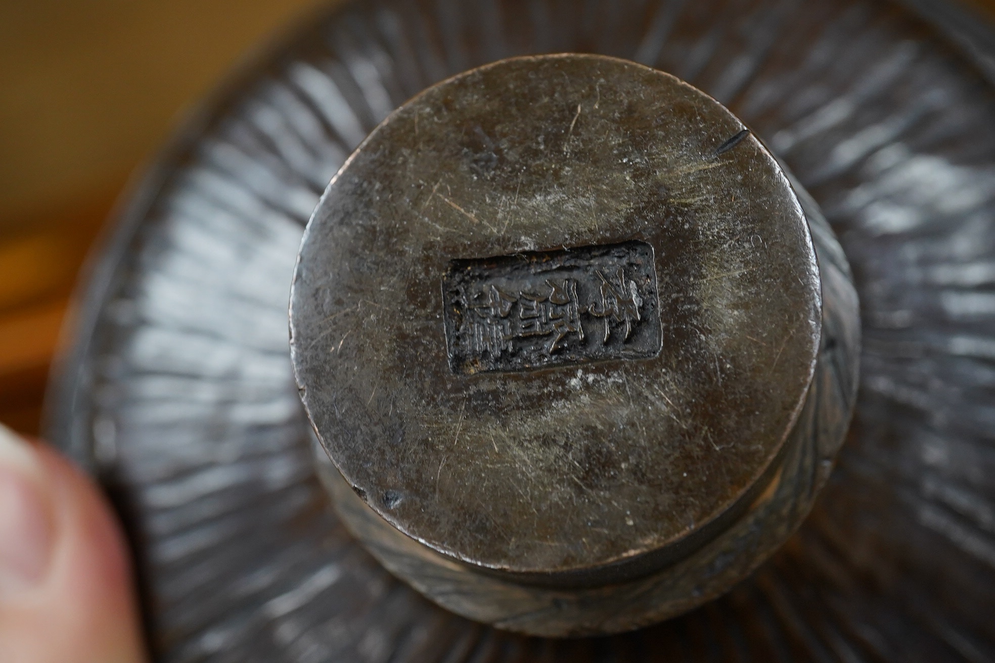 A Chinese bronze bowl, 17cm diameter, a lacquer vase, 15cm high, and a Chinese hand mirror with ivory inlay (3). CITES Submission reference 1UK5HNLM. Condition - fair to good